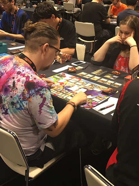 Alexis Ostrander plays a match on the main floor of Pro Tour Hour of Devastation