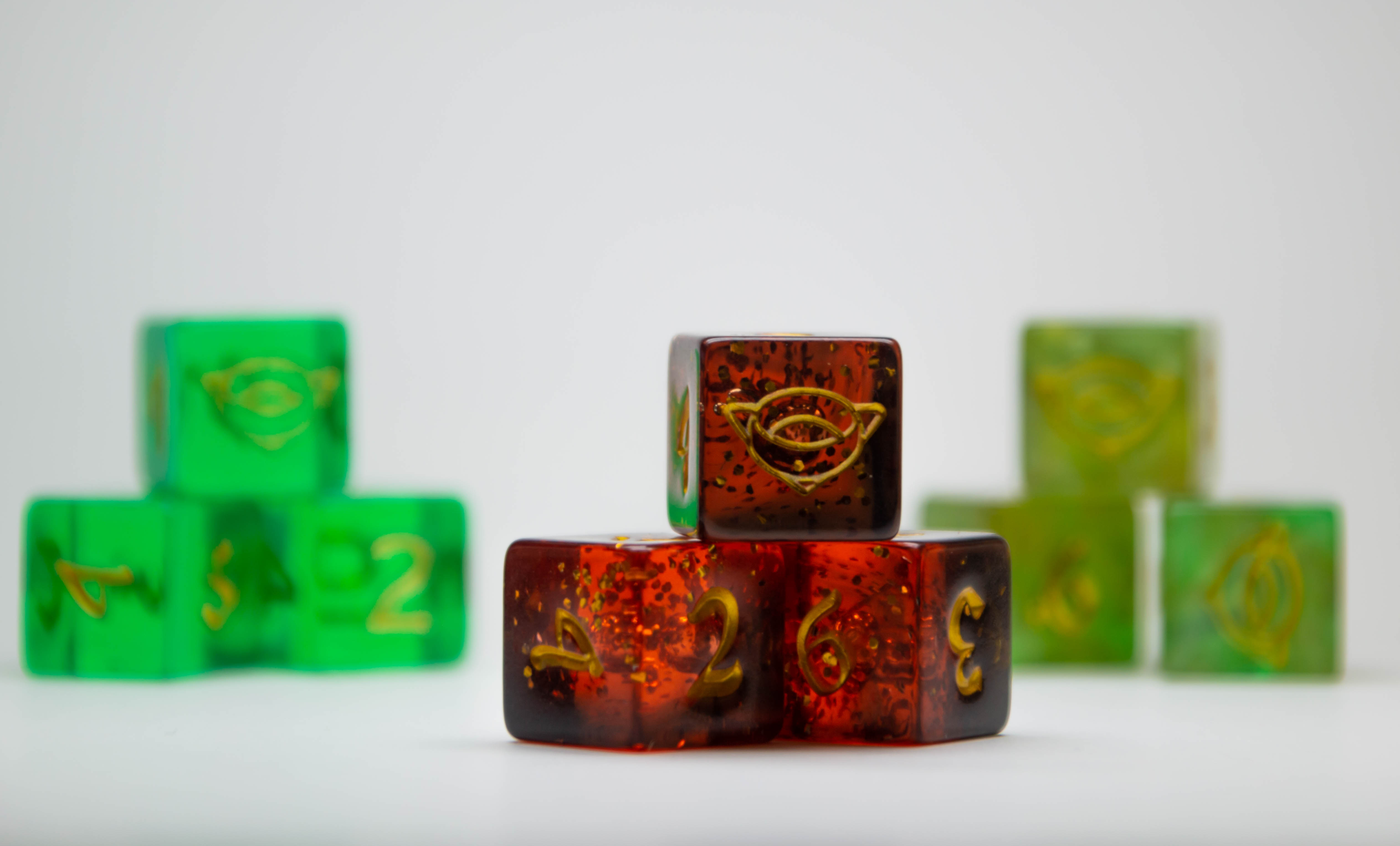 Magic Celebration Event dice in three colors side-by-side