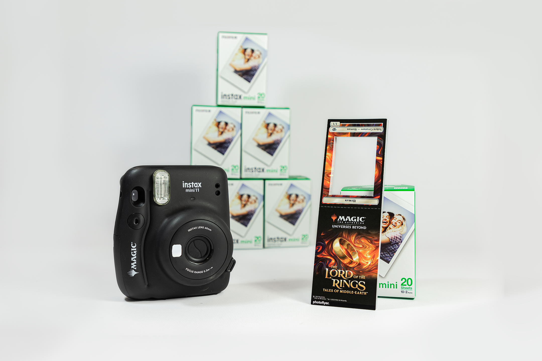 WPN Premium kit contents: an Instax Miini camera, packs of film, and 1/1 human token souvenir frame